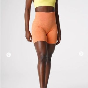 NVGTN Sunset Orange Seamless Scrunch Shorts